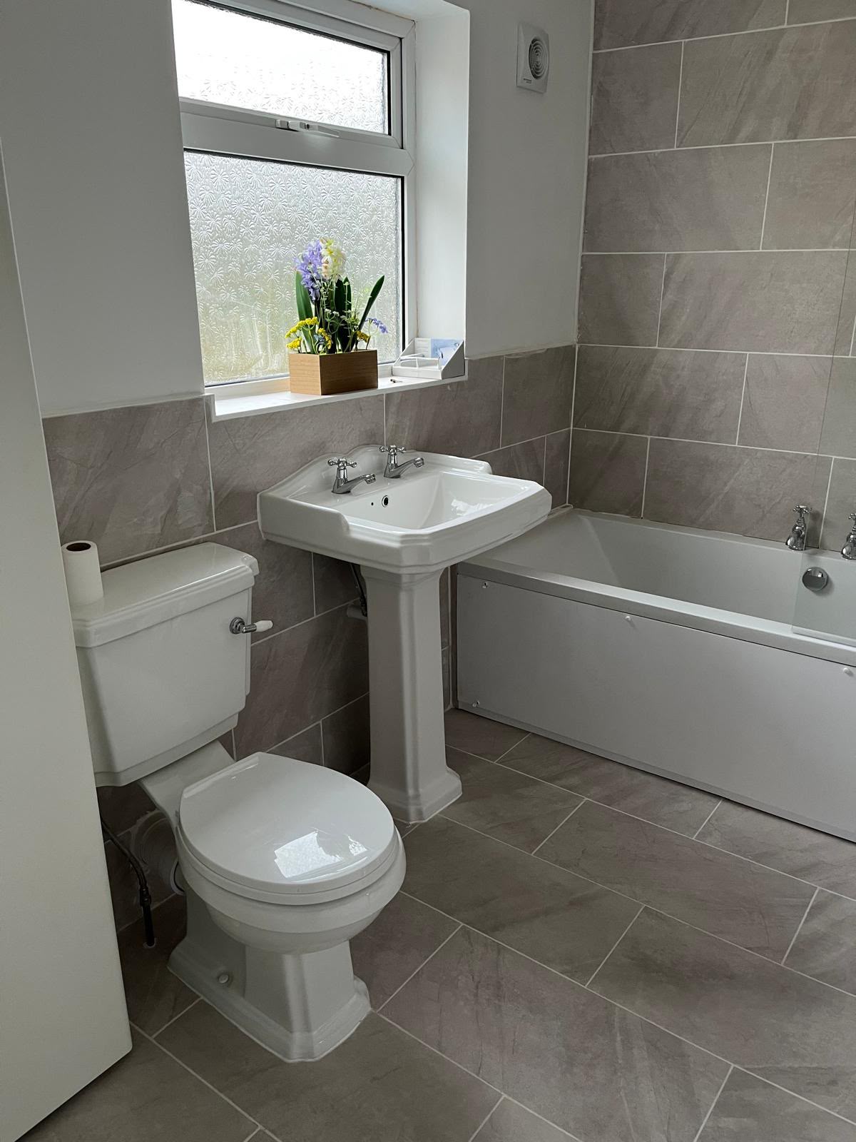 Completed bathroom suite installation by DR Smith Building, Swindon.